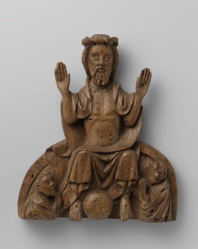Wooden vaulting boss with a representation of Christ with a globe at his feet
