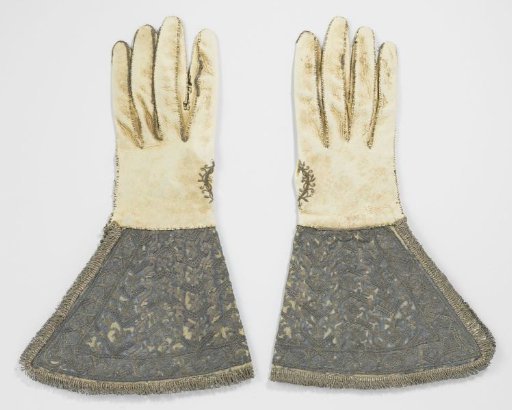 Leather glove with very wide cuffs, covered in blue satin, embroidered with silver thread and trimmed with silver fringe