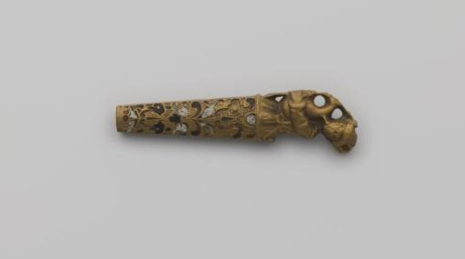 Knife handle of copper decorated with enamel and a bagpiper