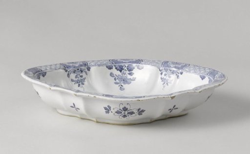 Shallow dish, painted in blue with two playing children by a ruin
