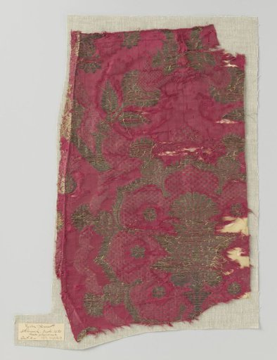 Fragment of red damask brocade with pomegranate motifs