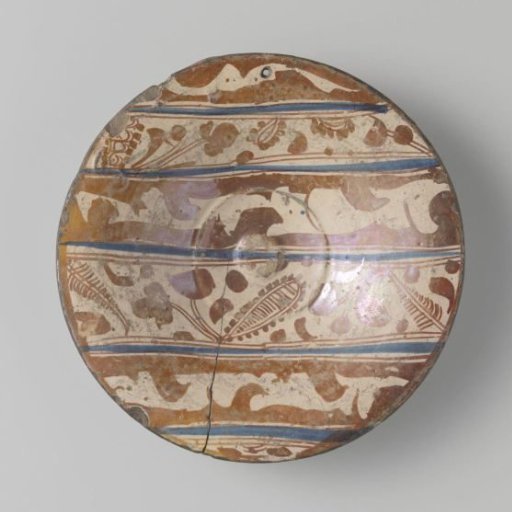 Dish painted with parallel lines and stylized leaf and flower ornaments