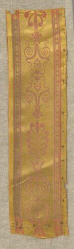 Silk border, fragment, woven on a ground of yellow satin