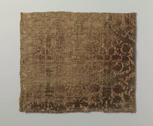 Fragment of silk velvet with cut-outs featuring a pattern of flower and leaf stems in green with red outlines