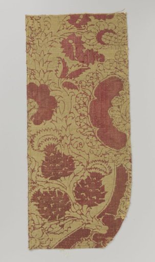Fragment of red velvet brocade with pomegranate motifs