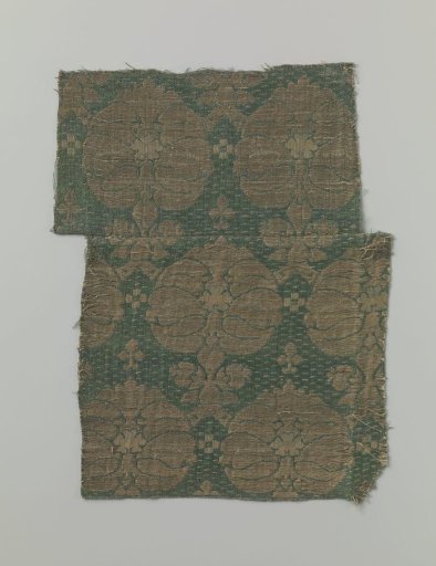 Fragment of green silk fabric with a pattern in gold thread