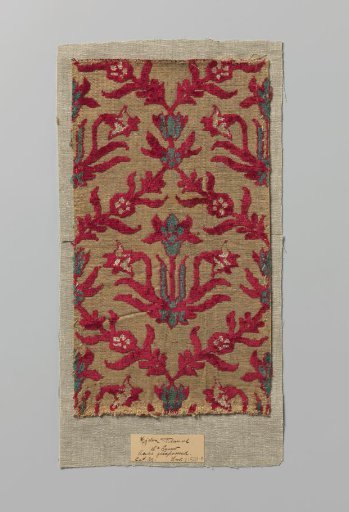 Fragment of multi-colored silk velvet with cutouts