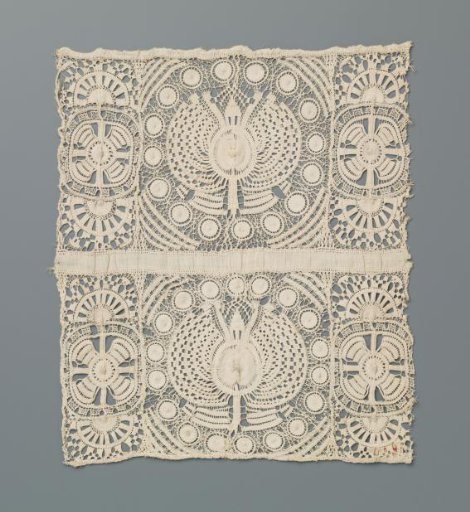 Fragment of needle lace with a round flower surrounded by sixteen suns