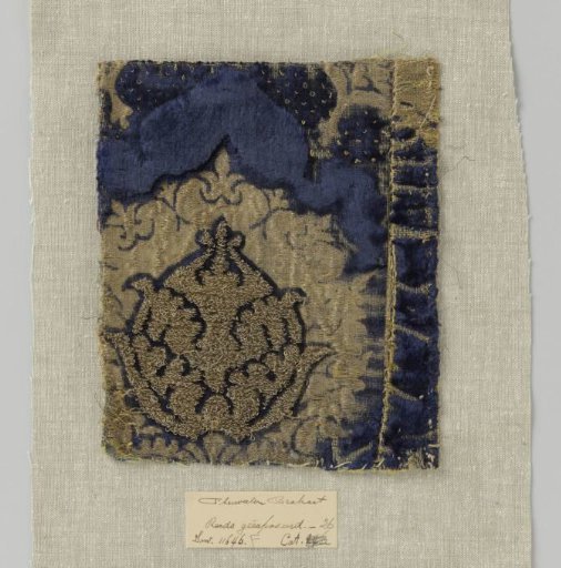Fragment of blue velvet brocade with pomegranate motifs