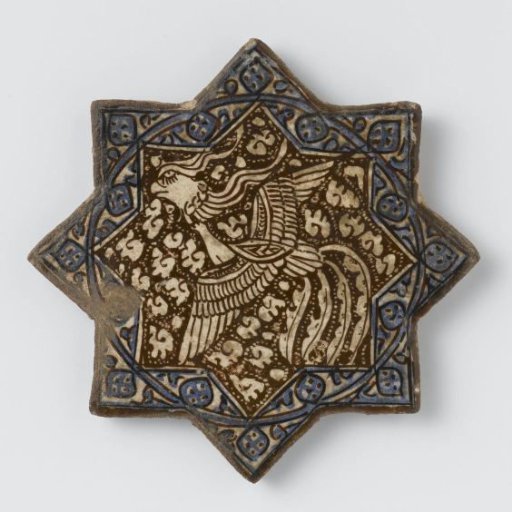 Star-shaped tile with a phoenix and stylized flower spray
