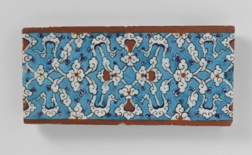 Tile with a cloud motif