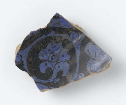 Fragment of a bowl with a floral scroll