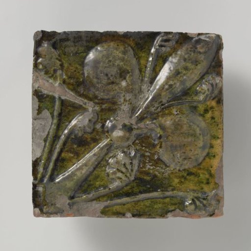 Tile decorated with a lily in relief