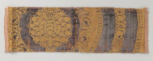 Fragment of purple velvet brocade with pomegranate motifs