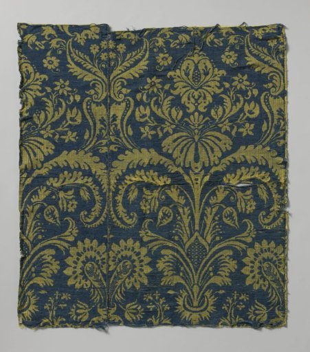 Fragment of yellow and blue colored silk fabric