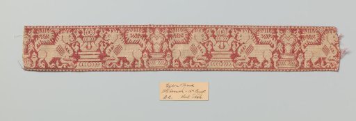 Silk fabric with a continuous pattern of symmetrical lions flanking a standard