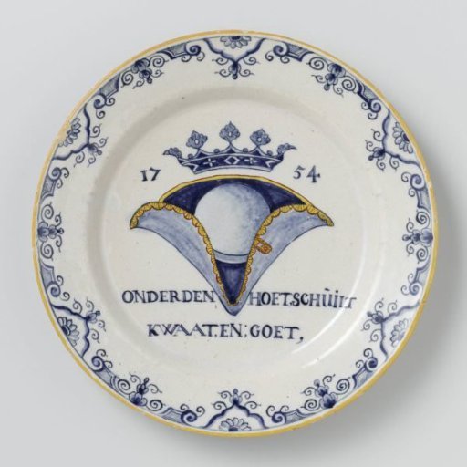 Plate, painted with a crowned hat and the text: under the hat lurks // evil, and; good,