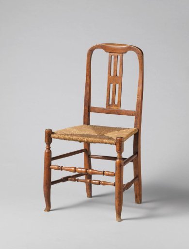 Chair with mat seat, slightly padded back and curved top rail