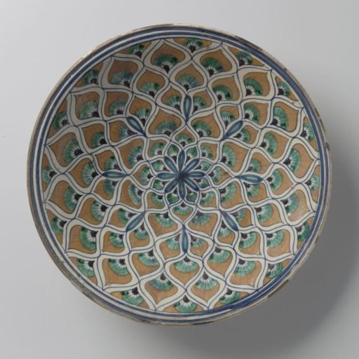 Plate, polychrome painted with a radiant motif of peacock feathers