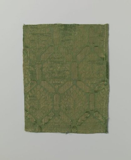 Fragment of green silk fabric with stylized leaf motif