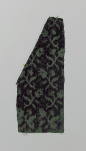 Fragment of green silk velvet with cut-outs featuring a pattern of horizontally arranged tulips