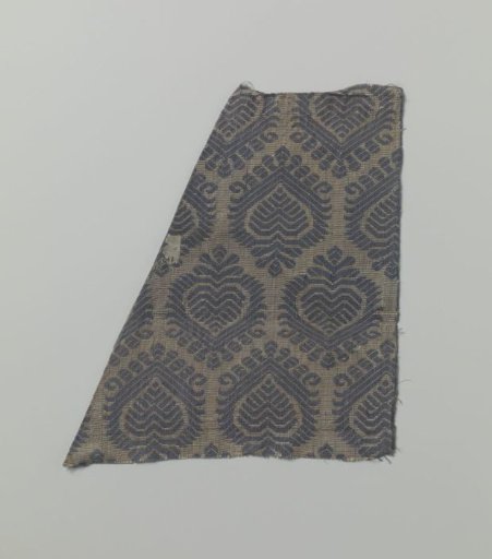 Fragment of yellow and blue silk fabric with palmette motifs