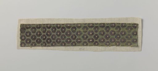 Fragment of green silk velvet with cut-out dot pattern