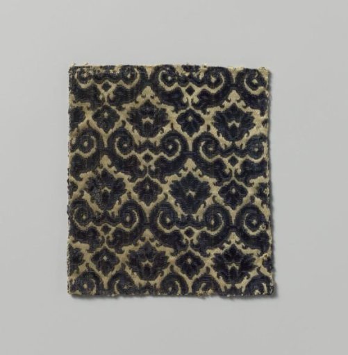 Fragment of purple and green silk velvet with cut-outs featuring a pattern of coupled volutes with palmettes