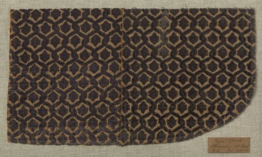 Fragment of yellow velvet with purple interlacing work