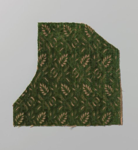 Fragment of green silk velvet with cutouts