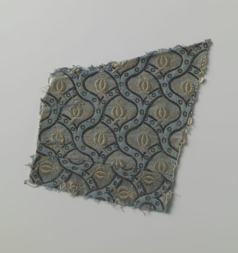 Fragment of a droguet with braid patterns and pomegranates