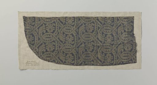Fragment of blue silk fabric with stylized acanthus scrolls and palmettes