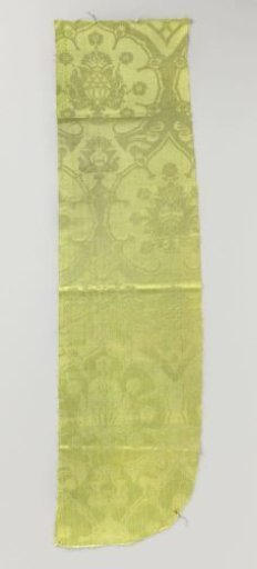Fragment of green silk damask with pomegranate motifs