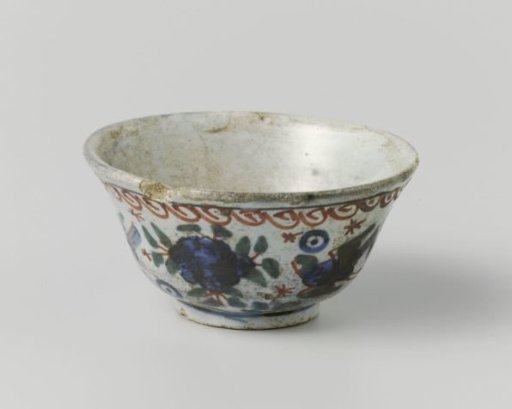 Head of faience painted with flowers and birds