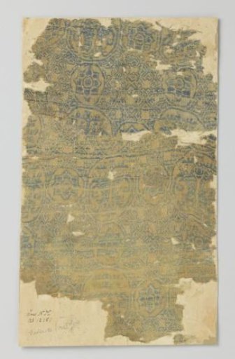 Fragment of yellow samite with a blue and white pattern of circular medallions and parrots
