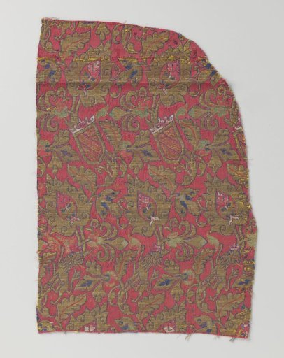 Fragment of red lampas with a pattern of stylized leaves, lions, and the coat of arms of Granada