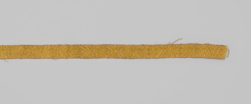 Passementerie of linen and yellow silk in a diamond pattern