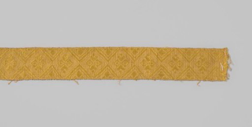 Passementerie of linen and yellow silk in a complex diamond pattern