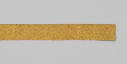 Passementerie of linen and yellow silk in a complex diamond pattern