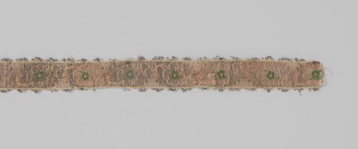 Ribbon of silk brocade; on a gold-colored background a continuous band of lobed balusters is applied, with a green flower in the center