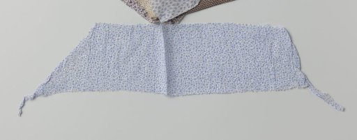 Fragment of printed cotton with blue floral scrolls on a white ground
