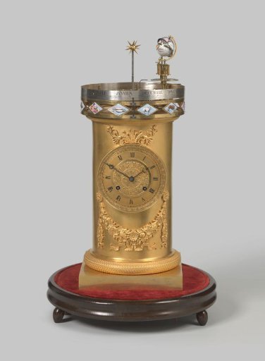 Planetarium clock in the form of a tower on a square base with decoration in enamel paint