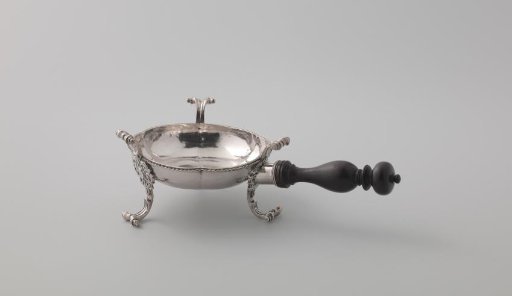 Comforter, six-lobed, on three legs with a shield-shaped center piece