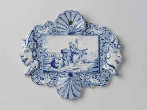 Plate, rectangular, with two shells and two fool's heads in relief