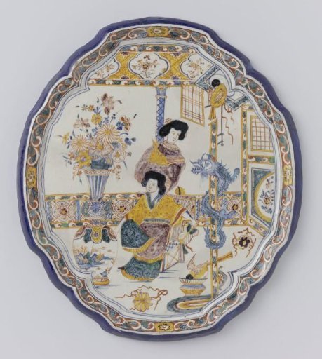 Plate, oval with scalloped edge. Multicoloured painted with Chinese women with flowers and birds on a terrace