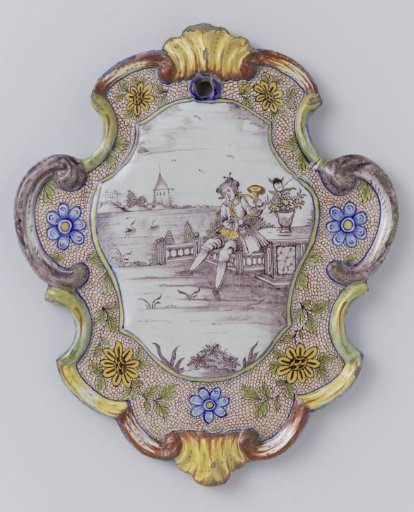 Plate, cartouche-shaped, painted in many colours with a man blowing a horn