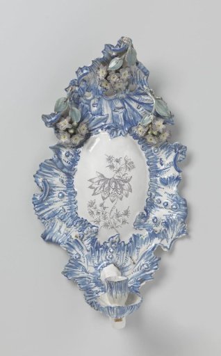 Oval appliqué with wall arm of multicolored painted faience