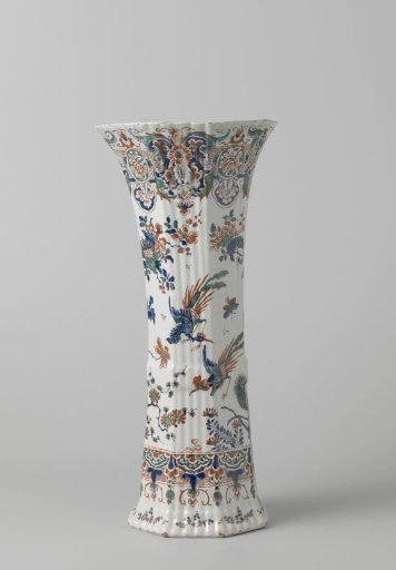 Octagonal ribbed pot of polychrome painted faience