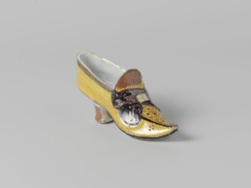 Yellow shoe with purple ribbon of faience