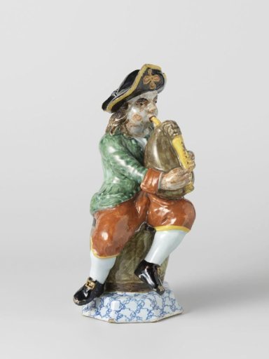 Bagpiper of multicoloured painted faience